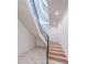 Elegant staircase with marble floors, wooden steps, and black wrought iron railing at 2837 Darlington Run, Duluth, GA 30097
