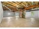 Unfinished basement with concrete floor, exposed ceiling, and natural light at 4826 Dean Sw Ln, Lilburn, GA 30047