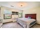 Bright bedroom with multiple windows, a double bed, and neutral decor at 4826 Dean Sw Ln, Lilburn, GA 30047