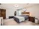 Spacious primary bedroom featuring a carpeted floor, walk-in closet, and natural light at 4826 Dean Sw Ln, Lilburn, GA 30047