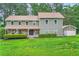 Lovely home featuring a well-maintained lawn and a detached garage at 4826 Dean Sw Ln, Lilburn, GA 30047