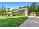 Charming home with a well-maintained lawn, detached garage, and cozy porch at 4826 Dean Sw Ln, Lilburn, GA 30047
