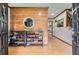 Entrance foyer with wood-look accent wall and hardwood floors at 4826 Dean Sw Ln, Lilburn, GA 30047