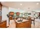 Spacious kitchen featuring granite countertops, stainless appliances, and wooden cabinetry at 4826 Dean Sw Ln, Lilburn, GA 30047