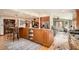 Open concept kitchen with seating island, wood floors and stainless steel appliances provides a great layout at 4826 Dean Sw Ln, Lilburn, GA 30047
