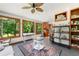 Bright sun room boasting large windows, tile floors, and nature views at 4826 Dean Sw Ln, Lilburn, GA 30047