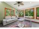 Cozy sun room with scenic views, comfortable seating, and ample sunlight at 4826 Dean Sw Ln, Lilburn, GA 30047