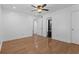 Comfortable bedroom with hardwood floors, and access to the ensuite bathroom and walk-in closet at 5250 Forest Downs Ln, Atlanta, GA 30349