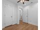 Bedroom with two doors and hardwood floors at 5250 Forest Downs Ln, Atlanta, GA 30349