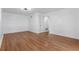 A freshly painted bedroom with hardwood floors, and an entrance to the ensuite bathroom at 5250 Forest Downs Ln, Atlanta, GA 30349