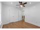 The bedroom has hardwood floors and a ceiling fan for comfort at 5250 Forest Downs Ln, Atlanta, GA 30349