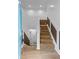 Entryway with wooden staircase and combination paint/wood-paneled walls at 5250 Forest Downs Ln, Atlanta, GA 30349