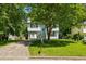 Charming two-story home with well-maintained lawn and mature trees at 5250 Forest Downs Ln, Atlanta, GA 30349