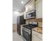 Bright kitchen with stainless steel appliances and granite countertops at 5250 Forest Downs Ln, Atlanta, GA 30349
