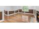 Living room featuring hardwood floors, paneled wall trim, and a fireplace at 5250 Forest Downs Ln, Atlanta, GA 30349