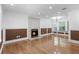 Spacious living room with fireplace, hardwood floors, and lots of natural light at 5250 Forest Downs Ln, Atlanta, GA 30349