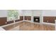 Cozy living room with stone fireplace, hardwood floors, and natural light at 5250 Forest Downs Ln, Atlanta, GA 30349