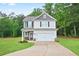 Charming two-story home with a well-manicured lawn and attached two car garage at 130 Bingley Ct, Covington, GA 30016