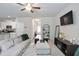 Open-concept living room with stylish furnishings, a TV, and modern decor at 130 Bingley Ct, Covington, GA 30016