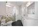Bathroom featuring white subway tile, floral shower curtain, and black tile floor, with a new toilet at 260 N. 18Th St # 10326, Atlanta, GA 30363