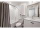 Clean bathroom featuring gray shower curtain, white subway tile, and a modern vanity with black accents at 260 N. 18Th St # 10326, Atlanta, GA 30363