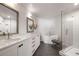 Bright bathroom featuring double vanity, soaking tub, and glass shower with gray tiled floors at 260 N. 18Th St # 10326, Atlanta, GA 30363