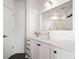 Bathroom showcasing white vanity with black accents, and modern fixtures with sleek tile floor at 260 N. 18Th St # 10326, Atlanta, GA 30363