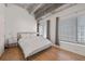 Bedroom featuring hardwood floors, exposed ductwork, and natural light from large windows at 260 N. 18Th St # 10326, Atlanta, GA 30363