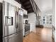Kitchen and staircase with modern appliances and a staircase blending functionality with urban living at 260 N. 18Th St # 10326, Atlanta, GA 30363