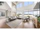 Bright living room featuring a modern sofa, large windows, and hardwood floors at 260 N. 18Th St # 10326, Atlanta, GA 30363