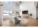 Bright living room featuring a modern sofa, large windows, and hardwood floors at 260 N. 18Th St # 10326, Atlanta, GA 30363