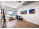 Office with an eclectic design, light hardwood floors, city views and a comfortable seating area at 260 N. 18Th St # 10326, Atlanta, GA 30363