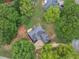 Bird's eye view of the house nestled among the lush greenery of mature trees on a spacious residential lot at 30 Stonewall Dr, Covington, GA 30016
