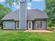 A backyard featuring a well manicured lawn, lush landscaping, and access to the home at 30 Stonewall Dr, Covington, GA 30016