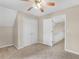 Bedroom featuring double closets and access to an upstairs hallway in neutral colors at 30 Stonewall Dr, Covington, GA 30016