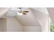 Carpeted room featuring a ceiling fan and unique architecture, great for a simple bedroom or flex space at 30 Stonewall Dr, Covington, GA 30016
