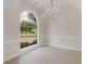 Dining room with a large window providing plenty of natural light and a view of the front yard at 30 Stonewall Dr, Covington, GA 30016