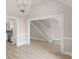 Dining room features an elegant chandelier, wainscotting and flows into the kitchen and foyer at 30 Stonewall Dr, Covington, GA 30016