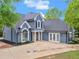 Well maintained two-story home with an arched window and well manicured lawn at 30 Stonewall Dr, Covington, GA 30016