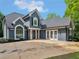Gorgeous two-story home with a well manicured lawn, arched window, and beautiful exterior at 30 Stonewall Dr, Covington, GA 30016