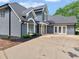 Beautiful exterior view of the home featuring a driveway and well manicured lawn at 30 Stonewall Dr, Covington, GA 30016