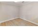 Bonus room featuring modern vinyl flooring, white trim, and recessed lighting for a bright, clean space at 30 Stonewall Dr, Covington, GA 30016