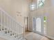 Elegant foyer with tall ceilings, natural light, and staircase leading to the second story of the home at 30 Stonewall Dr, Covington, GA 30016