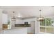 Bright kitchen with granite countertops and stylish pendant lighting at 30 Stonewall Dr, Covington, GA 30016