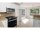 Charming kitchen area with granite countertops and white cabinets at 30 Stonewall Dr, Covington, GA 30016