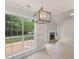 Spacious living room with vaulted ceiling, fireplace, and large windows at 30 Stonewall Dr, Covington, GA 30016