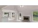Open floor plan with fireplace and views to the backyard at 30 Stonewall Dr, Covington, GA 30016