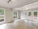Open living room filled with natural light, white trim, modern floors, and a walk-out patio at 30 Stonewall Dr, Covington, GA 30016