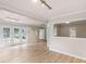 Open living room filled with natural light, white trim, modern floors, and a walk-out patio at 30 Stonewall Dr, Covington, GA 30016