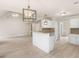 Open concept featuring a kitchen bar that overlooks the living area at 30 Stonewall Dr, Covington, GA 30016